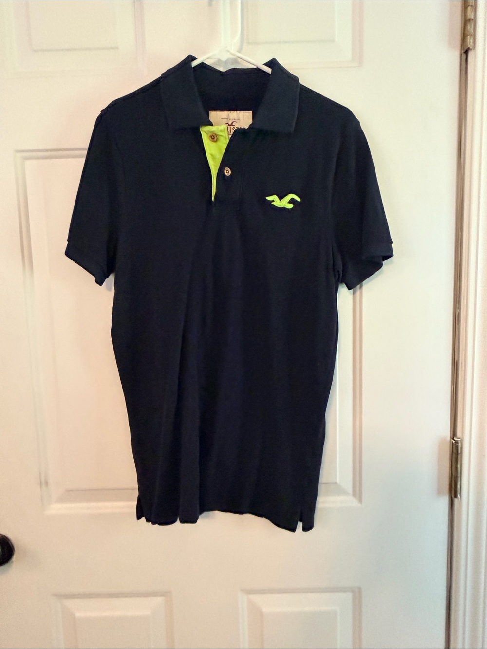 Hollister Men's Black Polo with Neon Green Logo and Inner Placket Accent